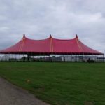 60ft X 120ft (18 X 36m) 3 pole red blackout tent on 10ft walls.